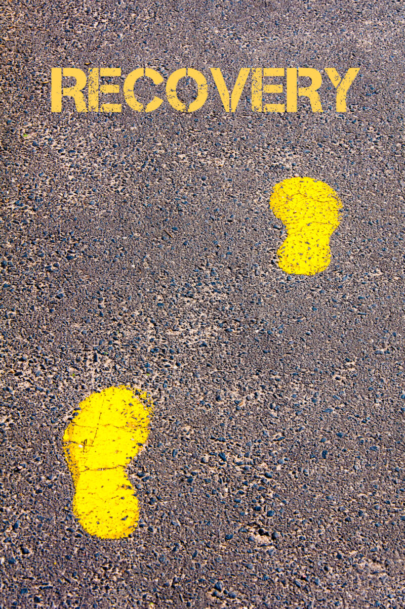 footsteps on sidewalk towards Recovery message, Healthy Living conceptual image